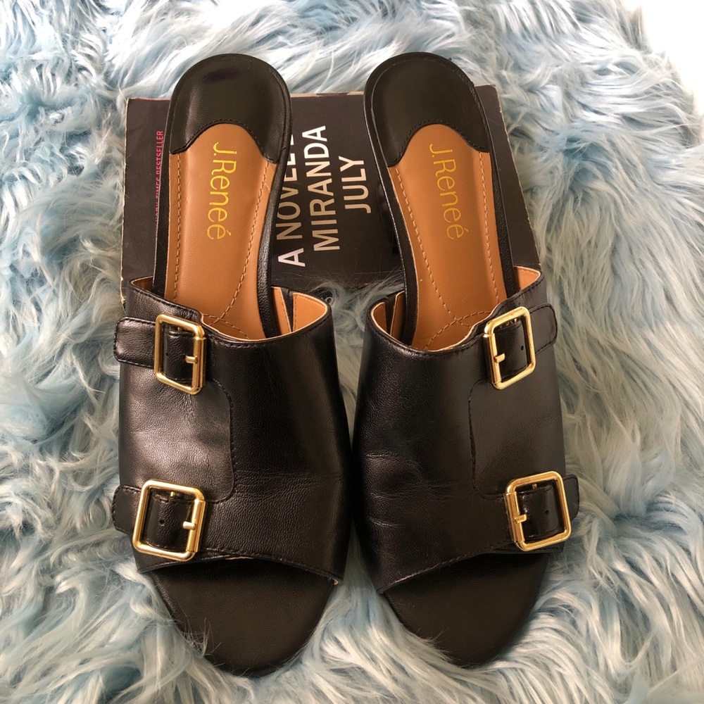 Black mules with gold buckles
